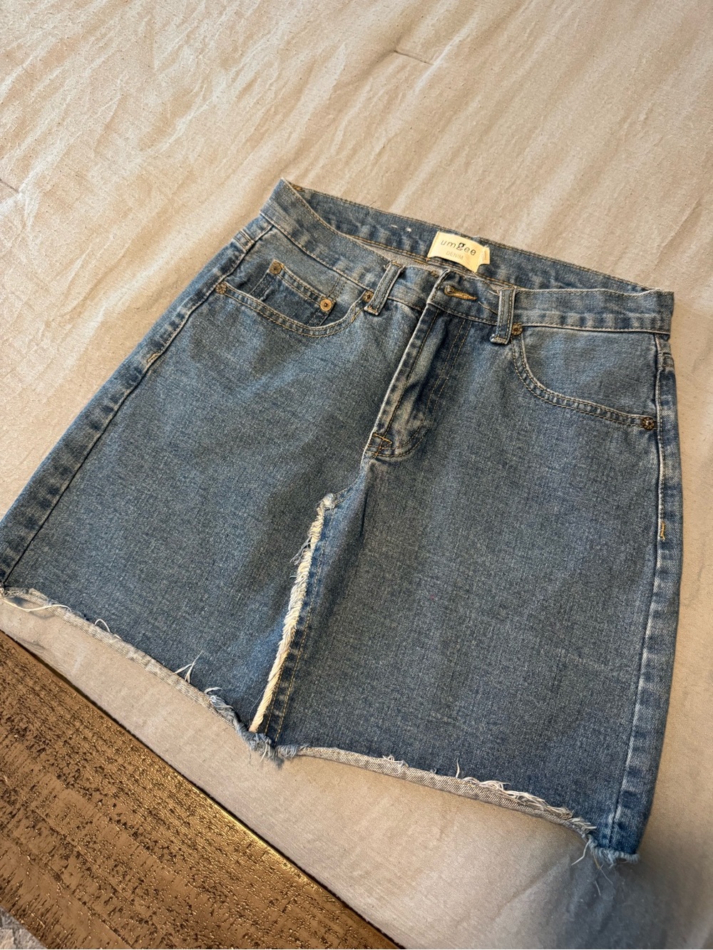 Umgee Mid-Wash Blue Denim A-Line Mini Skirt with Raw Hem
